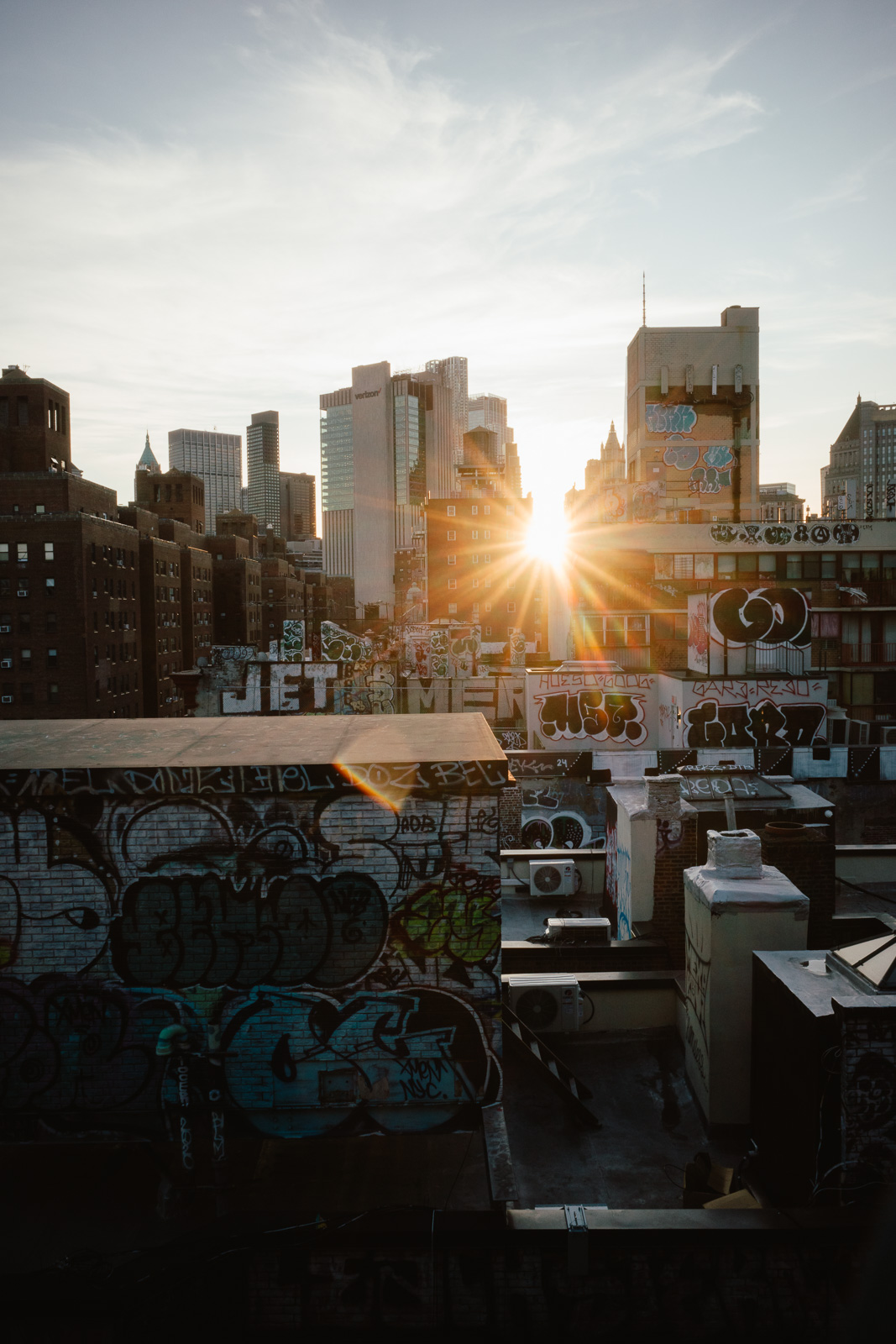 Graffiti rooftops in New York at sunset